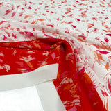 Tissu Crêpe Imprimé Scarabocchio rouge Made in Italy, à découvrir sur tessuti.fr