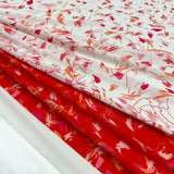Tissu Crêpe Imprimé Scarabocchio rouge Made in Italy, à découvrir dés maintenant sur tessuti.fr